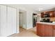 Spacious kitchen with ample storage, a stainless steel refrigerator, and easy access to other areas of the home at 104 Benedict Ln, Raleigh, NC 27614