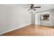 Bright living room with hardwood floors and passthrough to kitchen providing an open concept feel at 104 Benedict Ln, Raleigh, NC 27614