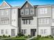 Charming townhome showcasing neutral tones, well-manicured landscaping and a welcoming entrance at 1041 Zelkova Ln, Chapel Hill, NC 27517