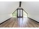 Spacious attic featuring hardwood floors, large windows, and white walls at 105 Litchfield Ct, Rocky Mount, NC 27803