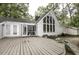 Spacious backyard with a deck, large windows, and a well-maintained lawn at 105 Litchfield Ct, Rocky Mount, NC 27803