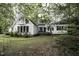 Charming home nestled among mature trees with private balcony and lush landscaping at 105 Litchfield Ct, Rocky Mount, NC 27803