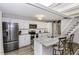 Modern kitchen featuring stainless steel appliances, a granite island, and white cabinets at 105 Litchfield Ct, Rocky Mount, NC 27803