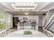 Bright, open kitchen with island, stainless steel appliances, and adjacent dining area bathed in natural light at 105 Litchfield Ct, Rocky Mount, NC 27803