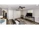 Relaxing living room with hardwood floors, a ceiling fan, and comfortable seating at 105 Litchfield Ct, Rocky Mount, NC 27803