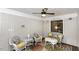 Cozy sunroom featuring white wicker furniture and a ceiling fan at 105 Litchfield Ct, Rocky Mount, NC 27803