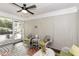 Inviting sunroom featuring white wicker furniture and a ceiling fan at 105 Litchfield Ct, Rocky Mount, NC 27803