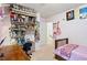 Charming bedroom featuring built-in shelving, desk, and a cozy bed with natural light at 107 Canyon Run, Cary, NC 27513