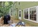Exterior shot of a house featuring a wooden deck with seating overlooking green backyard at 107 Canyon Run, Cary, NC 27513