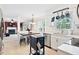 Bright kitchen with stainless steel appliances adjacent to a living space with fireplace and TV at 107 Canyon Run, Cary, NC 27513