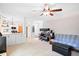 Open-concept living area with a kitchen view and a workstation, offering versatility at 107 Canyon Run, Cary, NC 27513