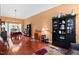 Spacious living room with hardwood floors, high ceilings, large windows, and elegant furnishings at 107 Canyon Run, Cary, NC 27513