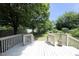 Inviting backyard deck and lush green space, perfect for outdoor entertaining and relaxation at 109 Perry Farms Dr, Apex, NC 27502