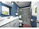 Bathroom showcasing tiled shower, modern vanity, and neutral walls at 109 Perry Farms Dr, Apex, NC 27502