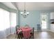 Bright dining area with chandelier, table and chairs, and sunny window at 109 Perry Farms Dr, Apex, NC 27502