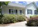 Charming front porch with white railings, blue shutters and a cozy atmosphere at 109 Perry Farms Dr, Apex, NC 27502