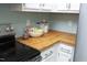 Kitchen area featuring butcher block countertops and a white appliance at 109 Perry Farms Dr, Apex, NC 27502