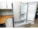 Bright kitchen with butcher block countertops and stainless steel refrigerator at 109 Perry Farms Dr, Apex, NC 27502
