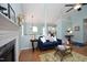 Open concept living room with fireplace and seamless flow into dining area at 109 Perry Farms Dr, Apex, NC 27502