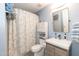 Well-lit bathroom with a shower/tub combo, sink and ample storage space at 11217 Maplecroft Ct, Raleigh, NC 27617
