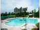 Large community pool with waterslide, offering fun and recreational amenities for residents at 11217 Maplecroft Ct, Raleigh, NC 27617