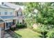 Aerial view of townhomes with manicured lawns and mature trees offering a serene setting at 11217 Maplecroft Ct, Raleigh, NC 27617
