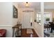 Welcoming foyer featuring hardwood floors, neutral walls, and stylish decor accents at 11217 Maplecroft Ct, Raleigh, NC 27617