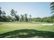 Scenic view of the golf course with lush green fairways, offering a serene and recreational experience at 11217 Maplecroft Ct, Raleigh, NC 27617