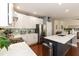 Contemporary kitchen with stainless steel appliances, white cabinets and a center island offering ample counter space at 11217 Maplecroft Ct, Raleigh, NC 27617
