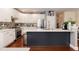 Modern kitchen features white cabinetry, stainless steel appliances, and a center island with seating at 11217 Maplecroft Ct, Raleigh, NC 27617