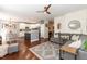 Open floor plan featuring a modern kitchen and an inviting living room with hardwood floors at 11217 Maplecroft Ct, Raleigh, NC 27617