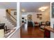 Inviting living room with hardwood floors, staircase, and cozy seating area at 11217 Maplecroft Ct, Raleigh, NC 27617