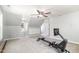 Bonus room featuring neutral carpet, large windows, and a home gym, perfect for a workout area at 113 Sycamore Ridge Ln, Holly Springs, NC 27540