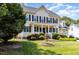Charming two-story home with a well-kept lawn and mature landscaping in a peaceful neighborhood at 113 Sycamore Ridge Ln, Holly Springs, NC 27540