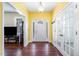 Bright foyer featuring gleaming hardwood floors, fresh paint, and elegant French doors at 113 Sycamore Ridge Ln, Holly Springs, NC 27540