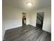 Open dining room with gray wood floors, white trim, and easy access to the kitchen at 1209 Waterford Green Dr, Apex, NC 27502