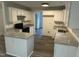 Updated kitchen with white cabinets, granite countertops, stainless sink, and new black appliances at 1209 Waterford Green Dr, Apex, NC 27502