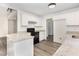 Modern kitchen with granite countertops, stainless steel appliances, and hardwood floors at 1209 Waterford Green Dr, Apex, NC 27502