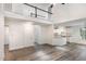 Spacious living room featuring high ceilings, white walls, and laminate flooring at 1209 Waterford Green Dr, Apex, NC 27502