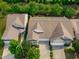 A beautiful aerial view showing a home with well manicured landscaping and an attached two car garage at 128 Arvind Oaks Cir, Cary, NC 27519