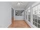 Spacious dining area with hardwood flooring, many windows, and views into other rooms at 128 Arvind Oaks Cir, Cary, NC 27519