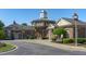 Exterior view of a brick building with a cupola, arched entry and manicured landscaping at 128 Arvind Oaks Cir, Cary, NC 27519
