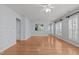 Open-concept living room features hardwood flooring, and access to the front door and other rooms at 128 Arvind Oaks Cir, Cary, NC 27519