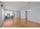 Expansive living room with hardwood floors, neutral wall color, ceiling fan, and lots of natural light at 128 Arvind Oaks Cir, Cary, NC 27519