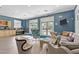 Inviting lounge featuring comfortable seating, a vibrant color scheme and ample natural light at 128 Arvind Oaks Cir, Cary, NC 27519
