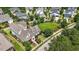 Aerial view of home with mature trees, lush landscaping, and a serene neighborhood setting at 1342 Briar Chapel Pkwy, Chapel Hill, NC 27516