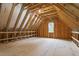 Unfinished attic space with exposed wood beams, offering potential for future customization and storage at 1342 Briar Chapel Pkwy, Chapel Hill, NC 27516