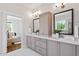 Bright bathroom boasts double sinks, vanity, and stylish fixtures with a bedroom view at 1342 Briar Chapel Pkwy, Chapel Hill, NC 27516