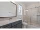 Modern bathroom featuring a glass-enclosed shower, vanity with stone countertop, and neutral colors at 1342 Briar Chapel Pkwy, Chapel Hill, NC 27516