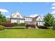 Stunning home featuring a meticulously landscaped front yard and classic architectural details and multi-level garden at 1342 Briar Chapel Pkwy, Chapel Hill, NC 27516